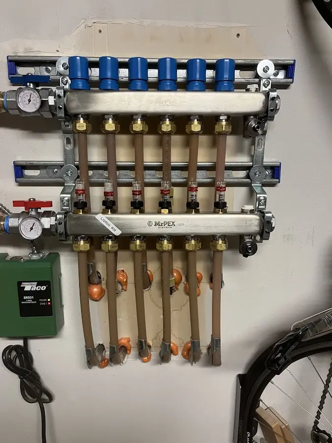 Plumber performing Water Heater Repair at a residential property in Canton